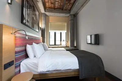 a bedroom with a white bed and a window at Bankerhan Hotel Galata - Adults Only Special Category in Istanbul