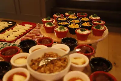 a table topped with cupcakes and bowls of food at Bankerhan Hotel Galata - Adults Only Special Category in Istanbul