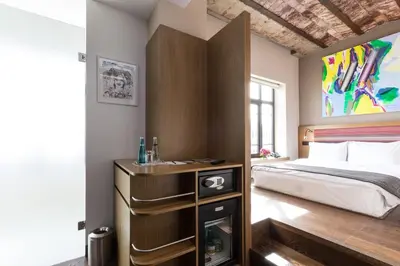 a bedroom with a bed and a fireplace at Bankerhan Hotel Galata - Adults Only Special Category in Istanbul