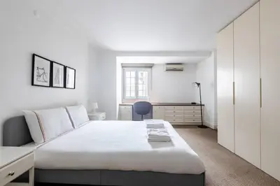 a white bedroom with a large bed and a desk at Luxury Modern 3Bed25Bath Central Bright Pad #375 in Istanbul