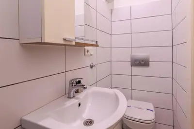 a white bathroom with a sink and a toilet at Luxury Modern 3Bed25Bath Central Bright Pad #375 in Istanbul