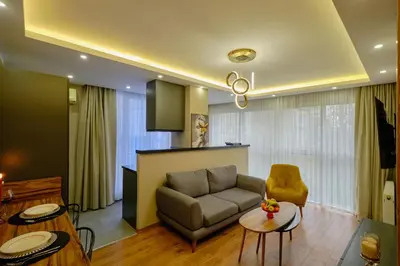 a living room with a couch and a table at Private Apartment at Beylikdüzü nearly to E5 2 in Beylikduzu