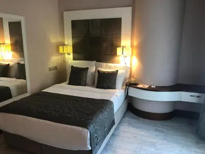 a hotel room with a large bed with two pillows at Elite Hotels Darica Spa & Convention Center in Gebze