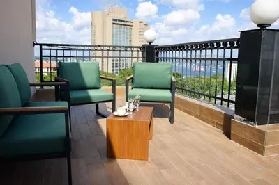 a balcony with two chairs and a coffee table at Riva Hotel Taksim in Istanbul