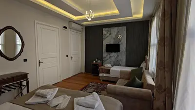 a hotel room with a bed and a mirror at Nuray Hotel in Istanbul