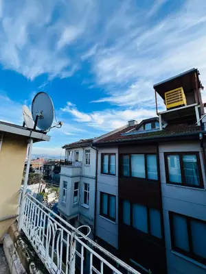a balcony of a building with a satellite at Nuray Hotel in Istanbul