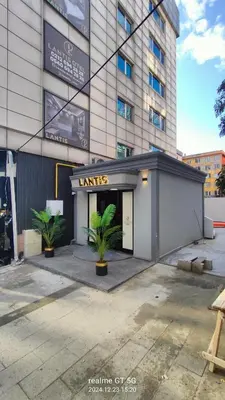 a store front of a building with plants in front at Lantis Otel in Avcılar