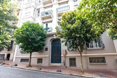 a building with a blue door on a street at NOA - Lüleci Hendek 54 in Istanbul