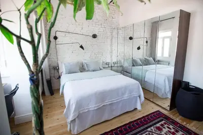 a bedroom with two beds and a mirror at Bright Cool Central 1Bed1Bath Stylish Home! #376 in Istanbul