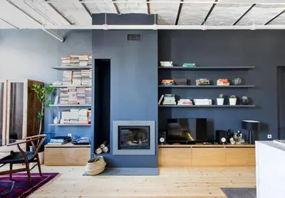 a living room with a fireplace and a blue wall at Bright Cool Central 1Bed1Bath Stylish Home! #376 in Istanbul