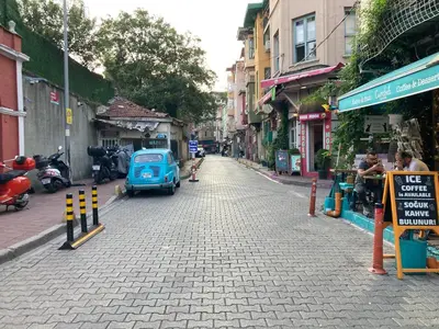 a small blue car parked on the side of a street at Balat Boutique Hotel in Istanbul