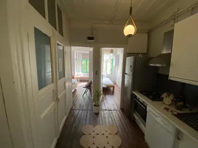a kitchen with a door and a kitchen rug on the floor at Balat Boutique Hotel in Istanbul