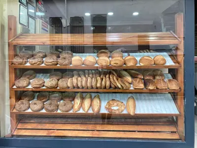 a bakery display case with lots of different types of bread at Balat Boutique Hotel in Istanbul