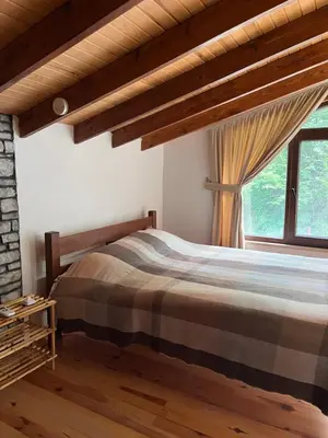 a bedroom with a bed and a window at Lal Hayal Konakları in Sapanca