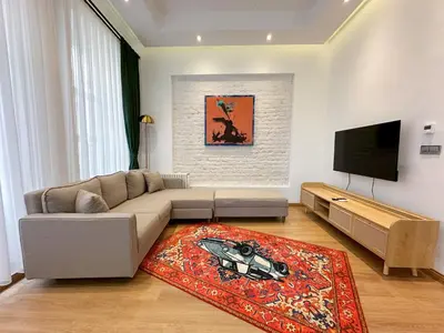 a living room with a couch and a flat screen tv at Essa Pera Boutique Galata in Istanbul