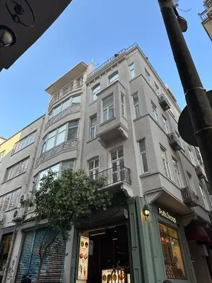 a tall building with a store in front of it at Essa Pera Boutique Galata in Istanbul