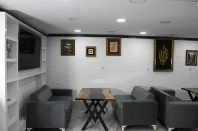 a waiting room with chairs and a table and a wall at Eclipse Hotel in Istanbul