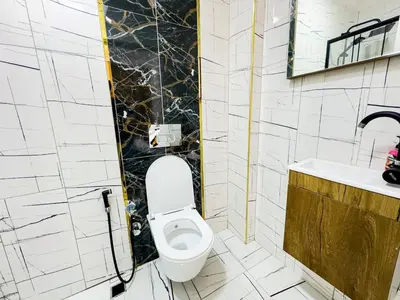 a bathroom with a toilet and a sink at Sisli Holiday 231 in Istanbul