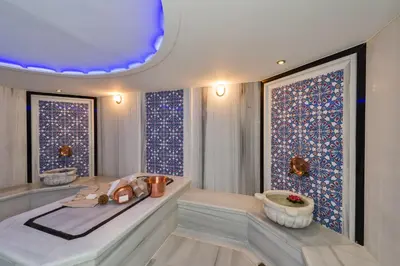 a bathroom with a tub and two windows at Hotel Boursier 1 & Spa in Istanbul