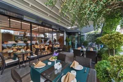an image of a restaurant with tables and chairs at Hotel Boursier 1 & Spa in Istanbul