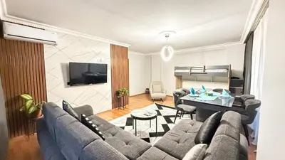 a living room with a couch and a table at Bomenti Sisli in Istanbul