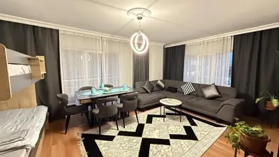a living room with a couch and a table at Bomenti Sisli in Istanbul