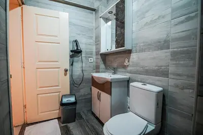 a bathroom with a toilet and a sink at Sahra Otel in Istanbul