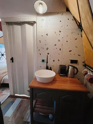 a bathroom with a sink and a wall with butterflies at Rcsapanca in Sapanca