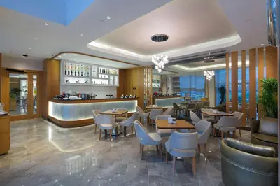a restaurant with tables and chairs and a bar at DoubleTree by Hilton Hotel Istanbul - Tuzla in Istanbul