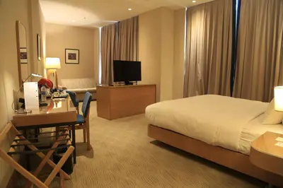 a hotel room with a bed and a desk at DoubleTree by Hilton Hotel Istanbul - Tuzla in Istanbul