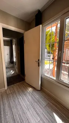 an empty room with a door and a window at Ali Baba Butik Otel in Gündoğdu