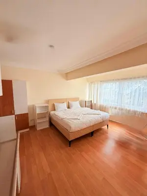 a bedroom with a bed and a large window at Haliç Konaklama in Istanbul