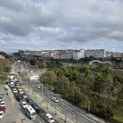 a busy city street with cars parked on the road at Haliç Konaklama in Istanbul