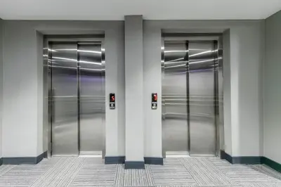 three metal elevators in a building with lights at Dedem Hotel Premium - Çorlu in Corlu