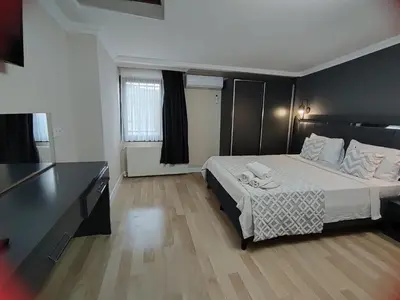 a hotel room with a bed and a desk at mars hotel in Istanbul