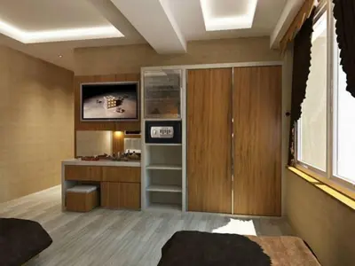 a bedroom with a closet and a desk at mars hotel in Istanbul