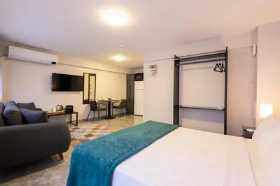 a hotel room with a bed and a couch at Obishu in Istanbul