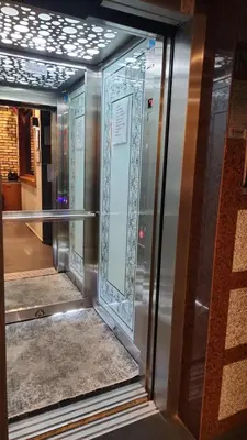a reflection of a room with glass doors in a building at Martin City Hotel in Bursa