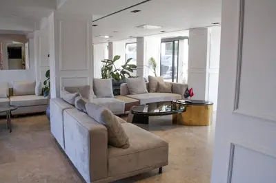 a living room with a couch and a table at Bohem Hotel in Beykoz