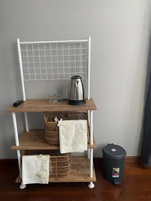 a shelf with a tea kettle and baskets on it at DESTA Turizm in Istanbul