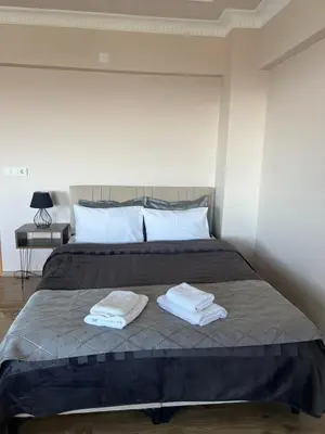 a bedroom with a bed with two towels on it at Montana butik pansiyon in Sapanca