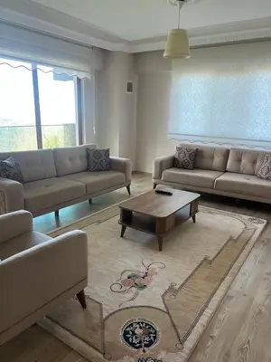 a living room with couches and a coffee table at Montana butik pansiyon in Sapanca