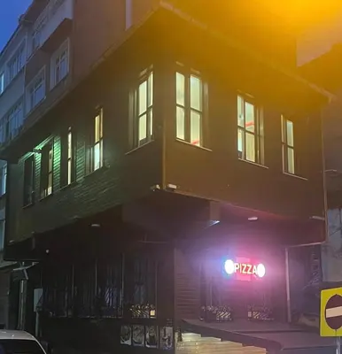 a building with a neon sign in front of it at Müstakil bina in Istanbul