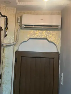a printer sitting on top of a door in a room at Müstakil bina in Istanbul