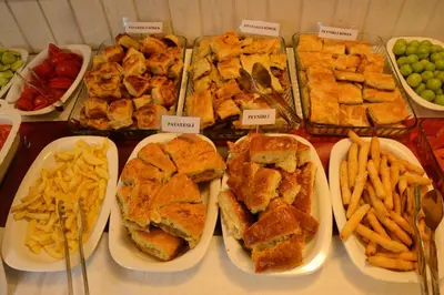 a buffet of food with sandwiches and french fries at İznik Seyir Otel in İznik