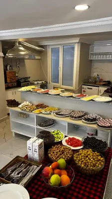 a kitchen with many bowls of fruit on display at Sultana Premier Hotel in Istanbul