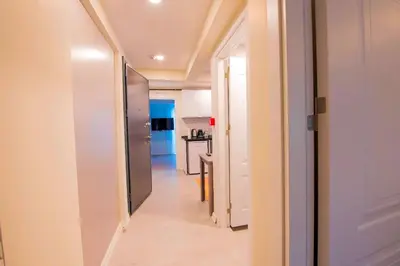 a hallway with a door leading to a kitchen at Mar Residence in Istanbul