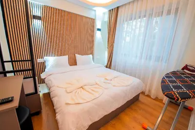 a bedroom with a bed with two towels on it at Mar Residence in Istanbul
