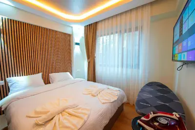 a hotel room with a bed with towels on it at Mar Residence in Istanbul