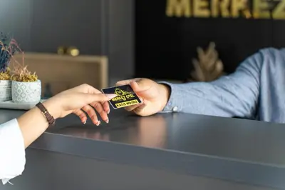 a person is holding up a small box of peanuts at Merkez Otel in Cerkezkoy